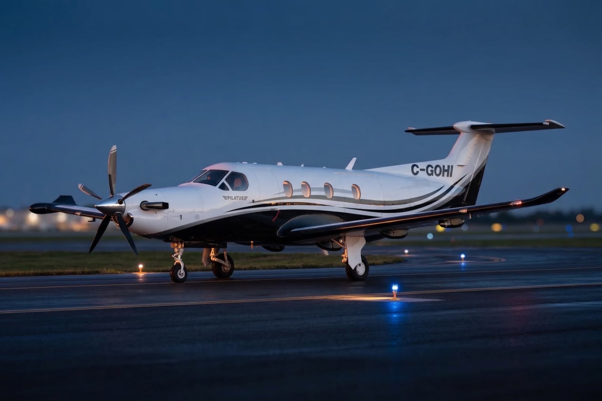 A NectAir Pilatus PC-12 on the runway at dusk
