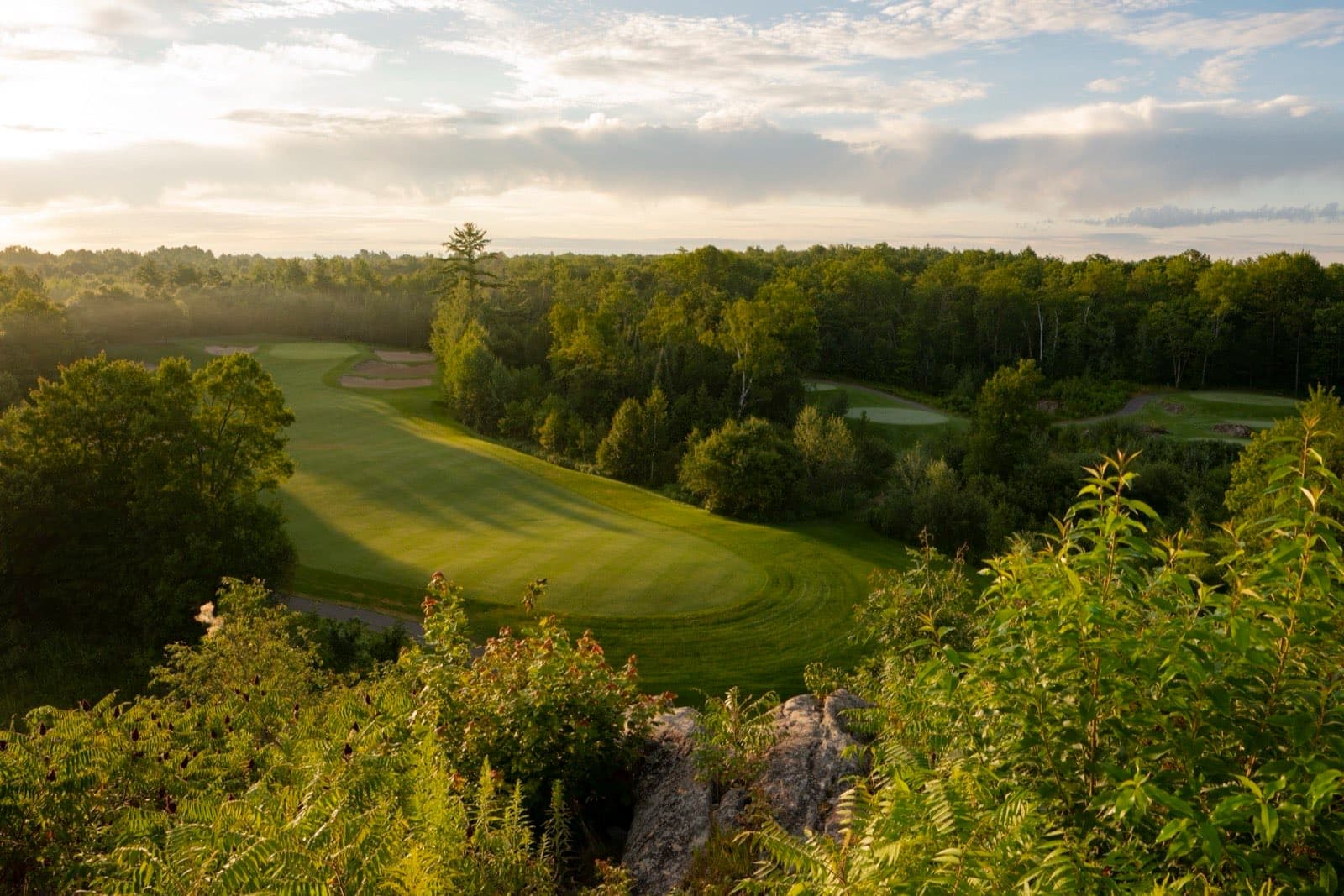 Muskoka Bay Club from the air, with fairways cut through granite and forest