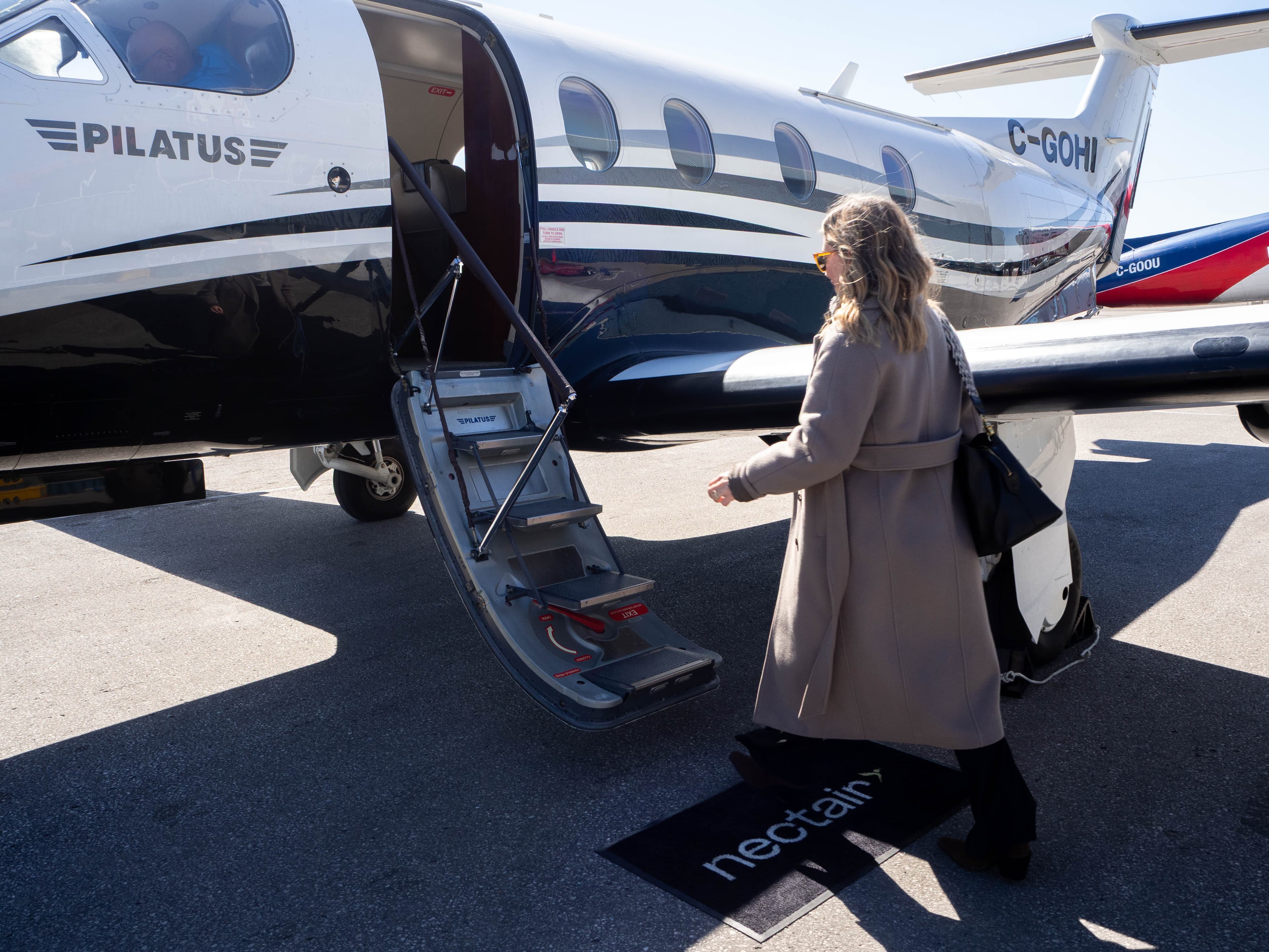Guest boarding the Pilatus PC-12 at Billy Bishop in the morning