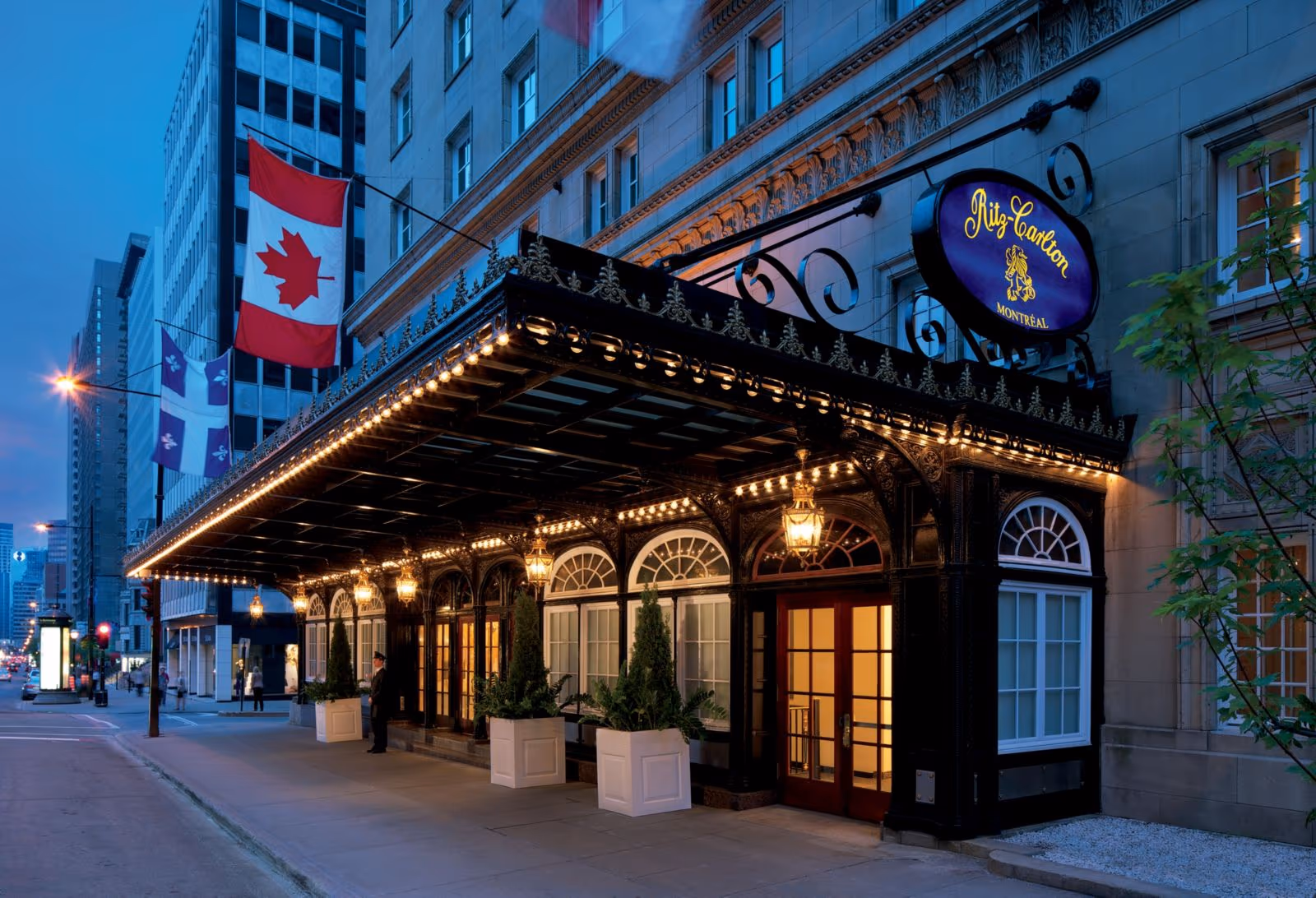 The illuminated entrance of The Ritz-Carlton, Montréal on Sherbrooke Street