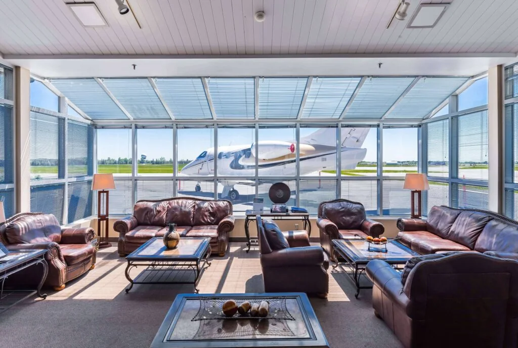 The Skyservice lounge in Ottawa, looking out at a jet on the ramp