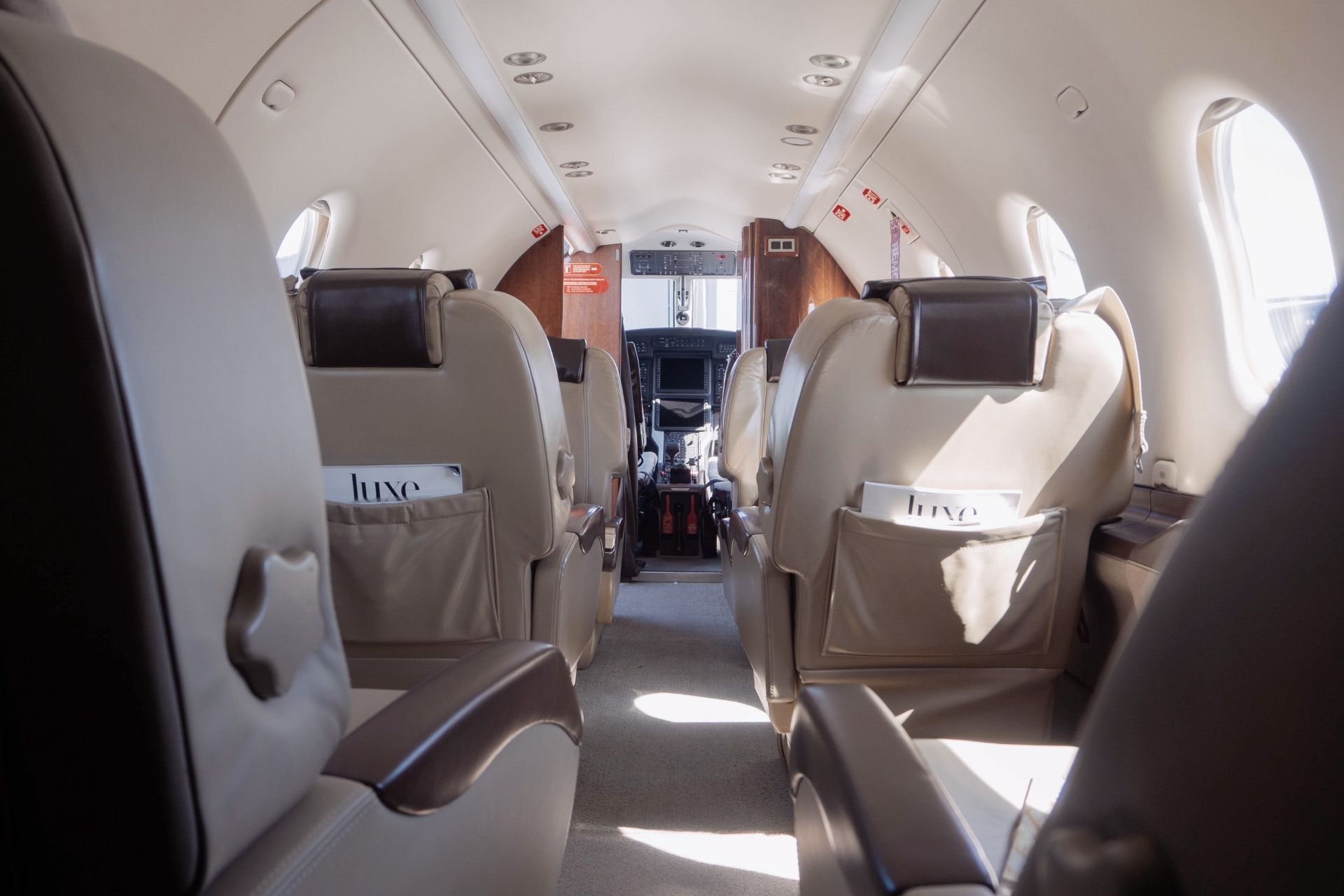Pilatus PC-12 cabin — executive seating with magazines